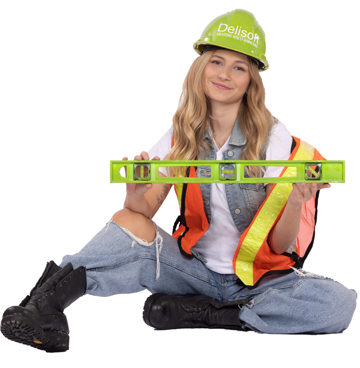 Jeune femme de construction qui tient un niveau
